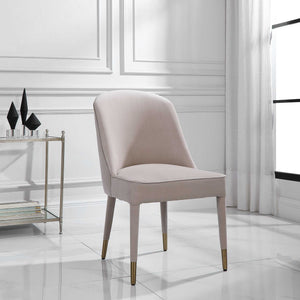 Set of two Uttermost Brie armless chairs with beige upholstery and wooden legs, modern design perfect for living room or lounge.