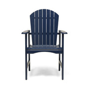 Two Noble House outdoor weather-resistant acacia wood Adirondack dining chairs set on a patio with lush greenery.