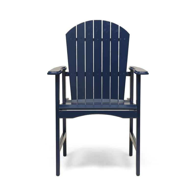 Two Noble House outdoor weather-resistant acacia wood Adirondack dining chairs set on a patio with lush greenery.
