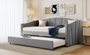 DreamHaus upholstered daybed sofa bed with trundle bed and wood slat frame, shown with plush fabric and sturdy wooden supports.
