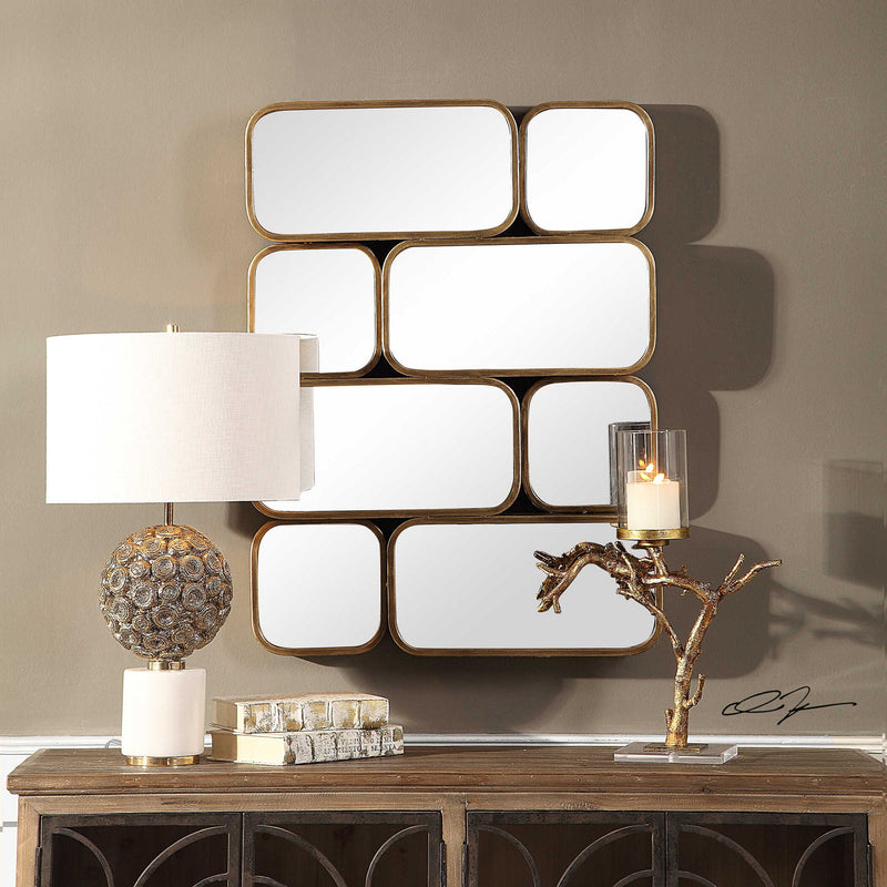 Uttermost Canute modern wall mirror with sleek frame, reflecting contemporary home decor style and natural light.