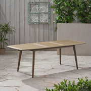 Noble House Placidity outdoor expandable dining table with slatted tabletop and tapered legs, ideal for patio or garden dining.
