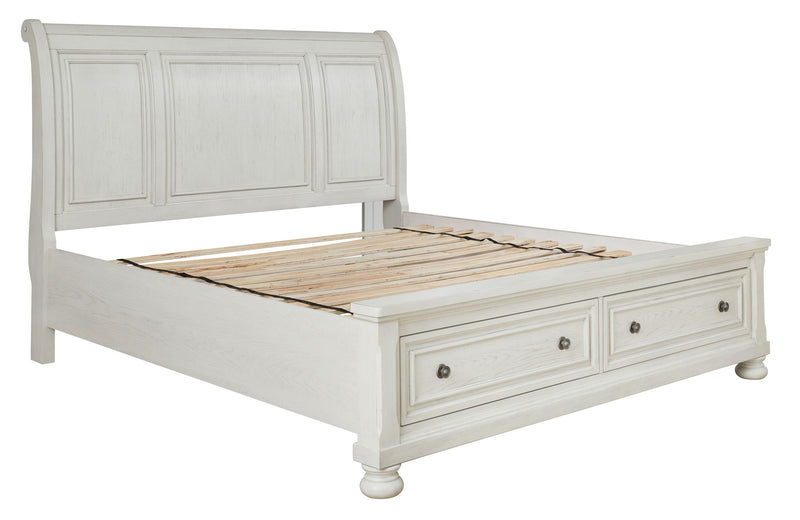 Ashley Robbinsdale Sleigh 6-piece bedroom set with a wooden sleigh bed, matching dressers, and nightstands in a classic bedroom style.