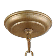 Uttermost Alenya 6-light gold chandelier with elegant shade design, hanging from a ceiling fixture in a modern interior setting.