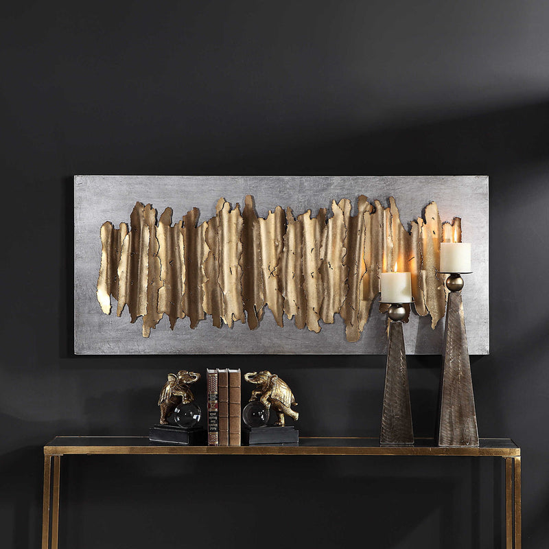 Gold metal wall decor by Uttermost featuring an intricate, modern design for stylish interior decoration.