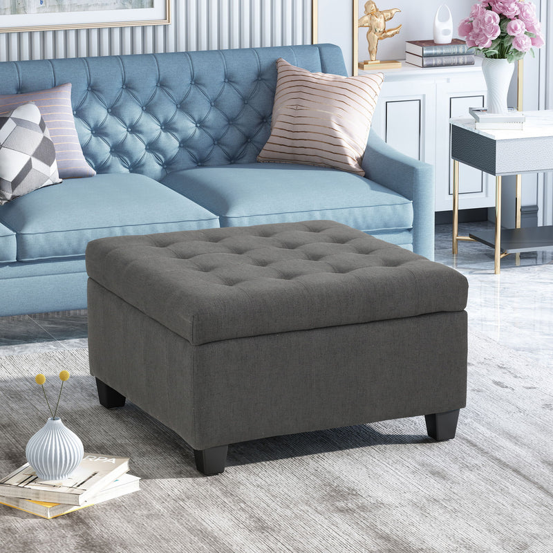 Noble House Isabella contemporary storage ottoman with cushioned top and wooden legs, used as a versatile living room accent piece.