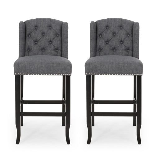 Pair of Noble House Vienna contemporary fabric tufted wingback counter stools, set of 2, with upholstered seats and wooden legs.