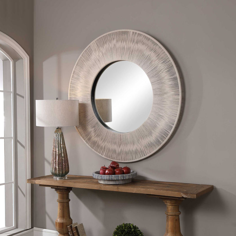 Round wall mirror with a sailor's knot design, decorative metal frame by Uttermost, suitable for nautical-themed decor.