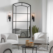 Black oversized arch accent mirror by Uttermost, featuring a sleek, modern design with a bold black frame.