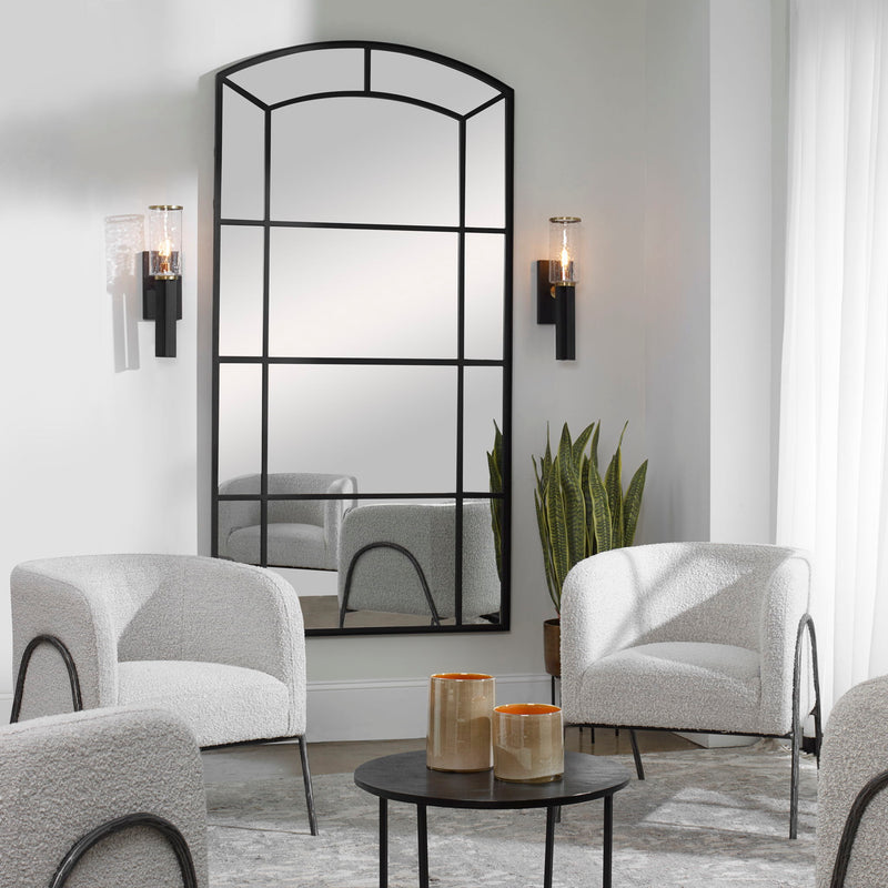 Black oversized arch accent mirror by Uttermost, featuring a sleek, modern design with a bold black frame.