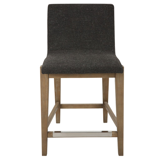 Uttermost Klemens counter stool with wooden legs and upholstered seat in a modern design, suitable for kitchen or bar area.