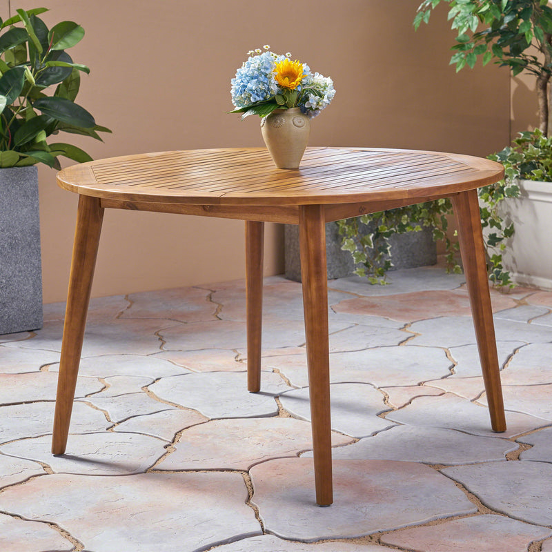 Modern Noble House Stamford outdoor dining table with sleek design, featuring a spacious surface and sturdy legs for outdoor dining.