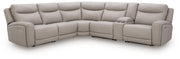 Benchcraft® Gravier reclining sectional with plush cushions and modern design, shown in a spacious living room setting.