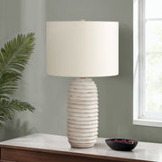 Cream resin transitional table lamp by 8th Street with a sleek, modern design and a sturdy base.