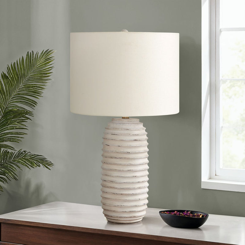 Cream resin transitional table lamp by 8th Street with a sleek, modern design and a sturdy base.