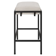 Uttermost Paradox white counter stool with sleek design and wooden legs, suitable for kitchen or bar area.