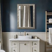 Silver Evelina Leaves Wall Mirror by Uttermost featuring a decorative leaf-shaped silver frame.