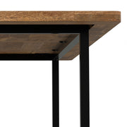 Simpli-Home Campbell handcrafted dining table with a wooden surface and sturdy legs, perfect for modern dining rooms.