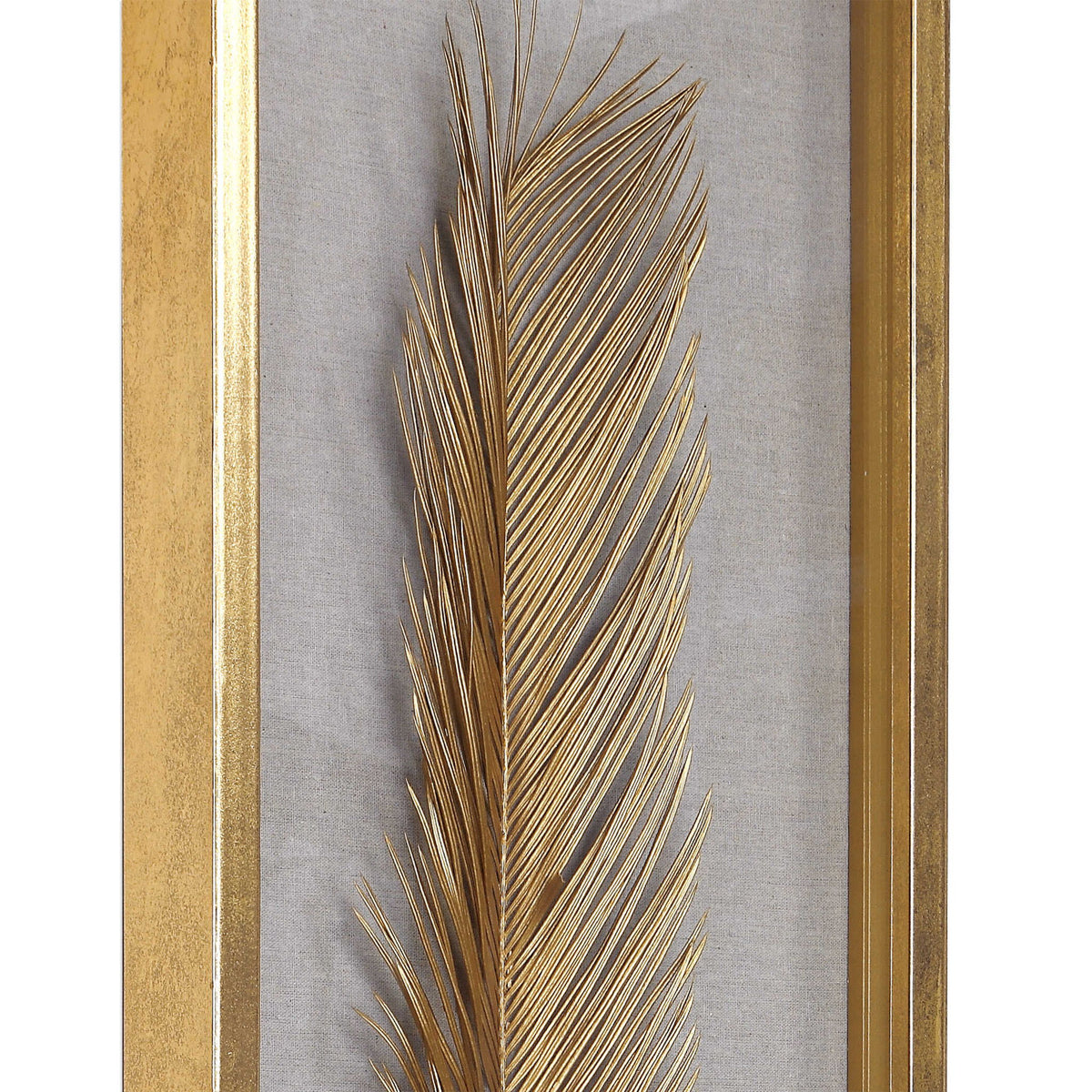 Set of three Uttermost Palma Leaf Shadow Box wall decor in gold, featuring intricate leaf designs for elegant interior accents.