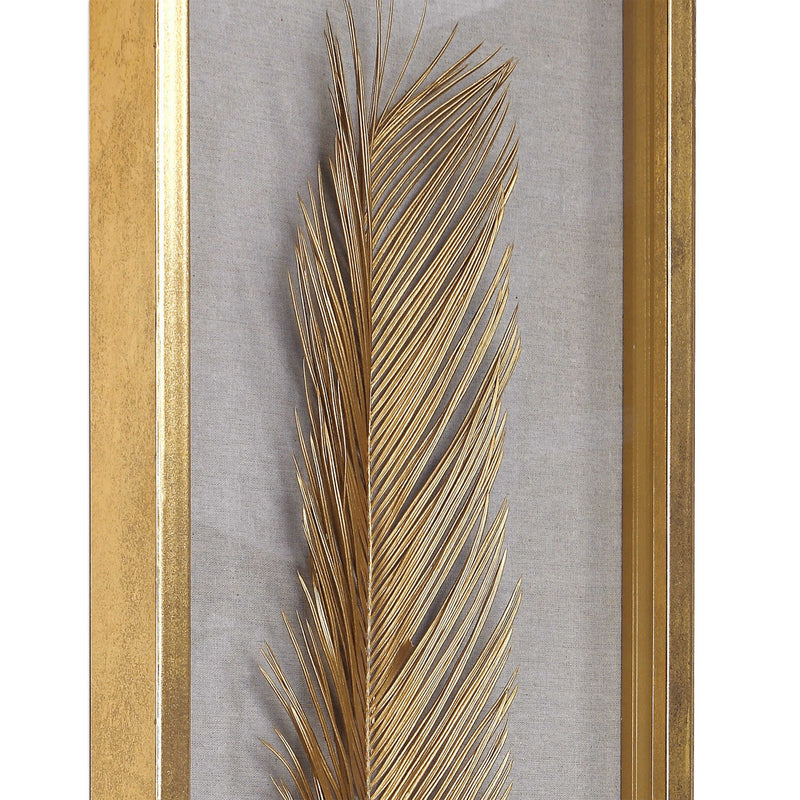 Set of three Uttermost Palma Leaf Shadow Box wall decor in gold, featuring intricate leaf designs for elegant interior accents.