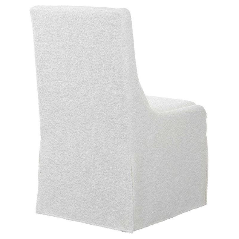 Uttermost Coley armless side chair with upholstered beige fabric and wooden legs, modern and stylish seating for living spaces.