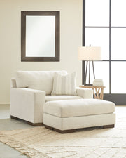 Signature Design by Ashley Maggie living room set with stationary chair and ottoman, featuring plush upholstery and modern style.