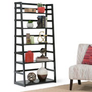 Handcrafted Acadian ladder shelf bookcase by Simpli-Home with multiple wooden shelves and a natural finish, standing against a wall.