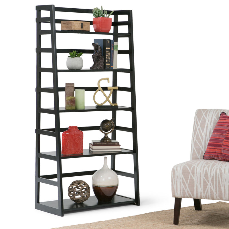 Handcrafted Acadian ladder shelf bookcase by Simpli-Home with multiple wooden shelves and a natural finish, standing against a wall.