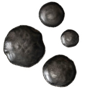 Set of four Uttermost Lucky Coins wall bowls for decor, featuring intricate designs and metallic finishes, arranged on a wall.
