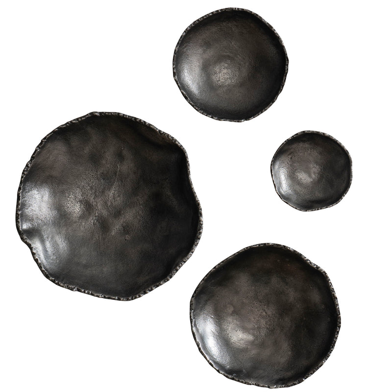 Set of four Uttermost Lucky Coins wall bowls for decor, featuring intricate designs and metallic finishes, arranged on a wall.
