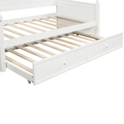 White DreamHaus twin size daybed with matching twin size trundle bed, featuring a classic wooden frame and clean design.