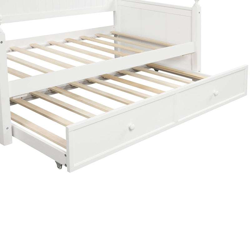 White DreamHaus twin size daybed with matching twin size trundle bed, featuring a classic wooden frame and clean design.