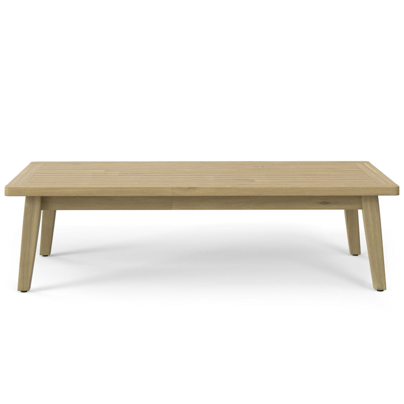 Simpli-Home Palmetto outdoor coffee table in light teak wood, featuring a sturdy rectangular design for outdoor seating areas.