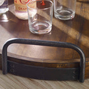 Dark brown round wooden tray by Uttermost, featuring a smooth finish and natural wood grain, ideal for serving or decorative use.