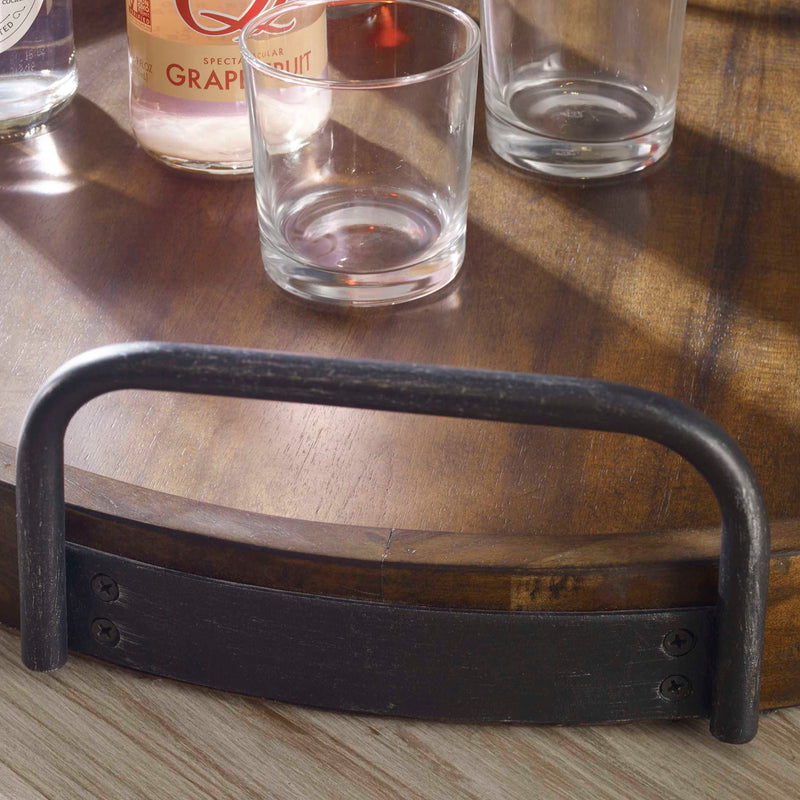 Dark brown round wooden tray by Uttermost, featuring a smooth finish and natural wood grain, ideal for serving or decorative use.