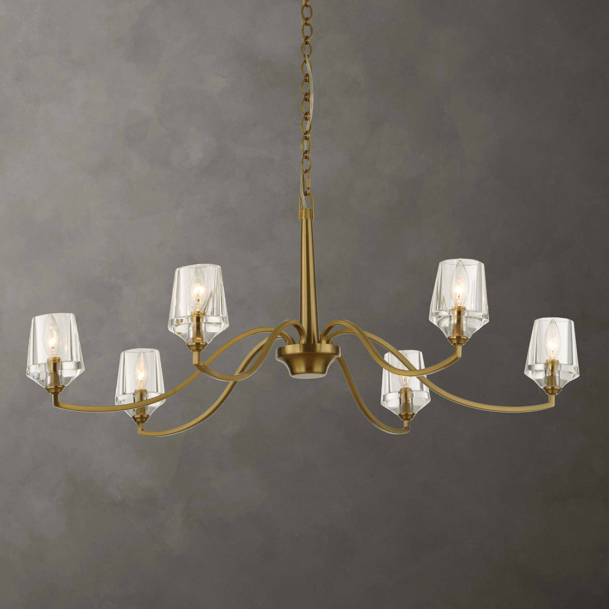 Uttermost Barcelona 6-light brass chandelier with gold finish, featuring elegant curved arms and classic design for sophisticated lighting.