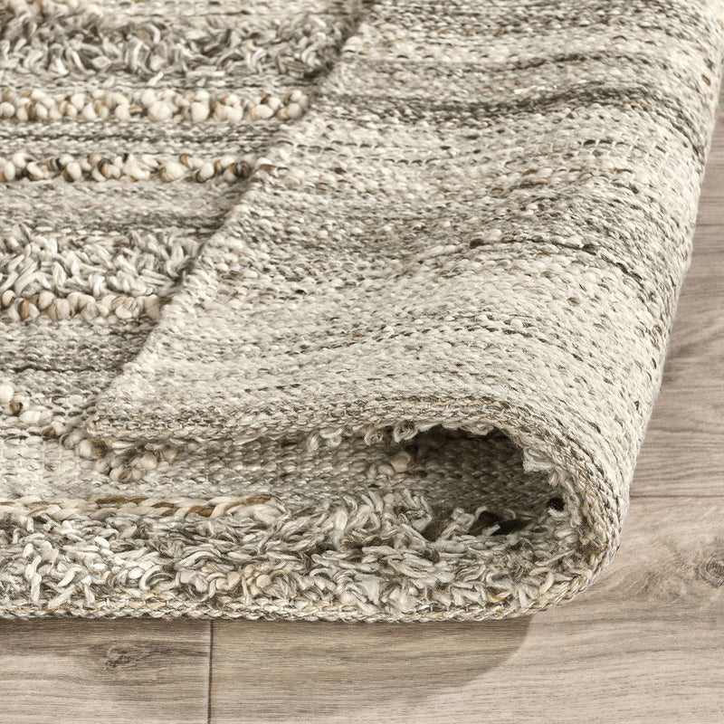 Classic Home Fallon indoor/outdoor rug with geometric pattern, suitable for both indoor and outdoor spaces, in neutral tones.