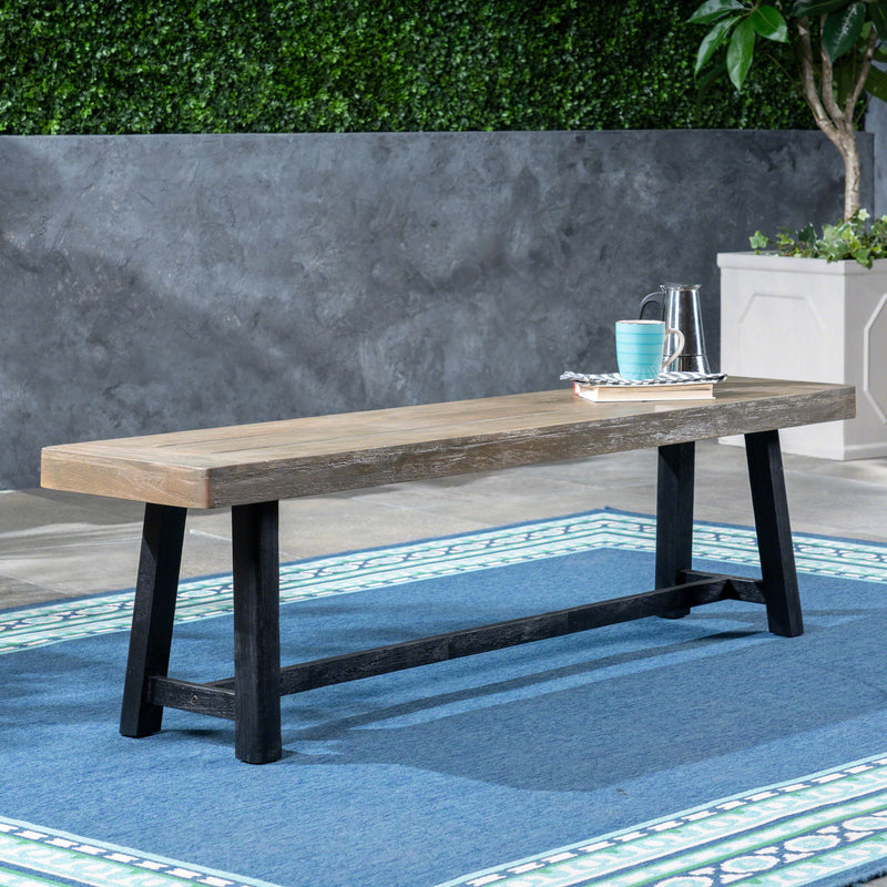 Noble House Cloud outdoor bench with acacia wood frame and slat panel design, showcasing a sturdy seating surface and natural wood finish.