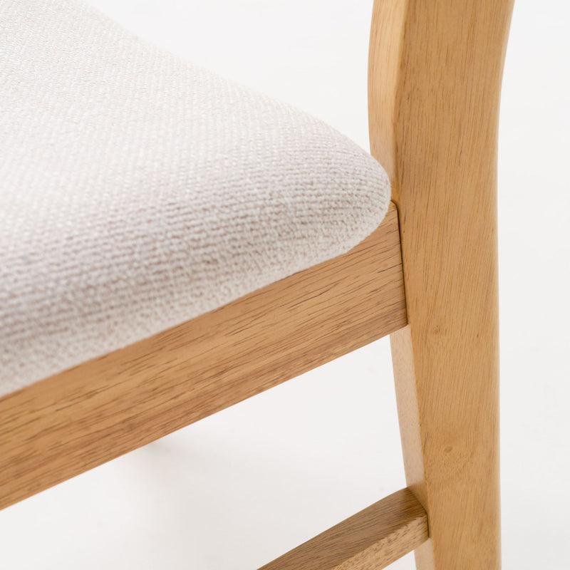 Set of 2 Noble House dining chairs with cushioned seats, featuring wooden legs and upholstered comfort for dining room use