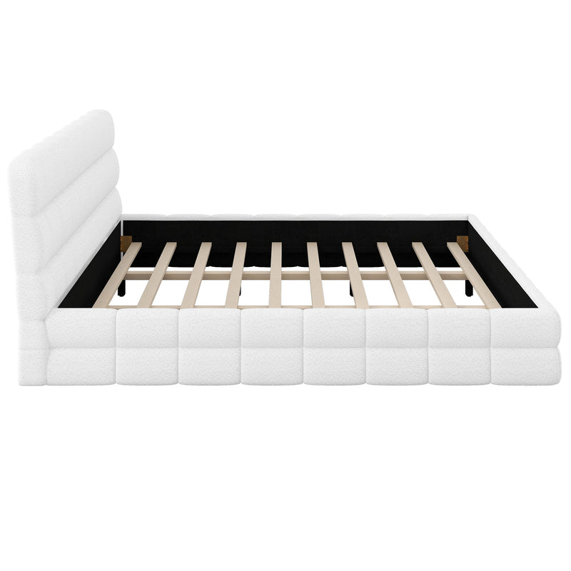 Dreamland upholstered platform bed with a padded headboard, featuring a modern design and neutral fabric upholstery.