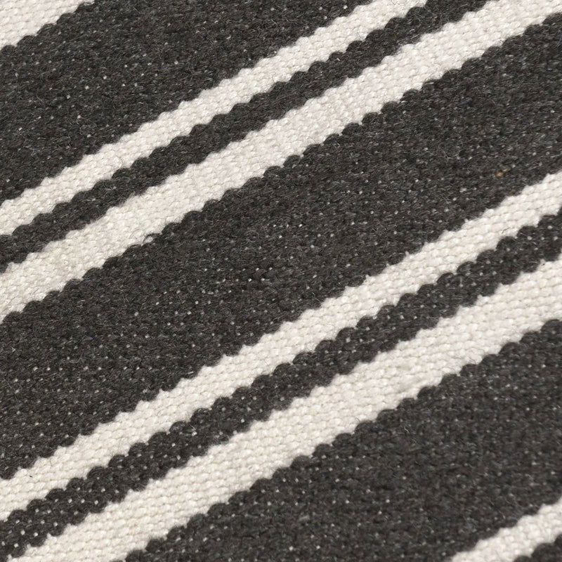 Classic Home Palma stripe area rug with bold linear pattern, soft texture, and neutral colors suitable for modern living spaces.