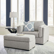 Benchcraft Evansley living room set with stationary chair and matching ottoman, featuring plush fabric and modern design.