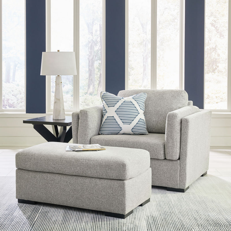 Benchcraft Evansley living room set with stationary chair and matching ottoman, featuring plush fabric and modern design.