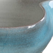 Uttermost Blue Crest ceramic bowl in blue, showcasing its smooth round shape and glossy glazed finish.