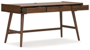 Signature Design by Ashley Lyncott home office desk with a spacious wooden writing surface and modern design.