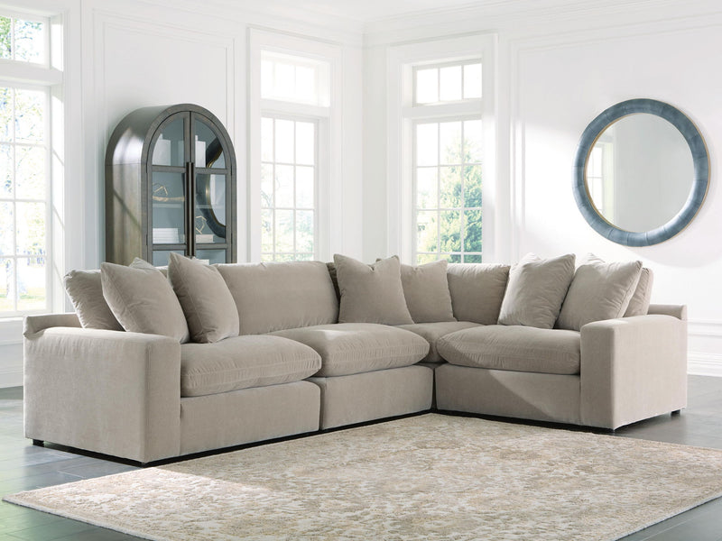 Benchcraft Maxton Heights stationary sectional with plush cushions and modern design, shown in a neutral fabric.