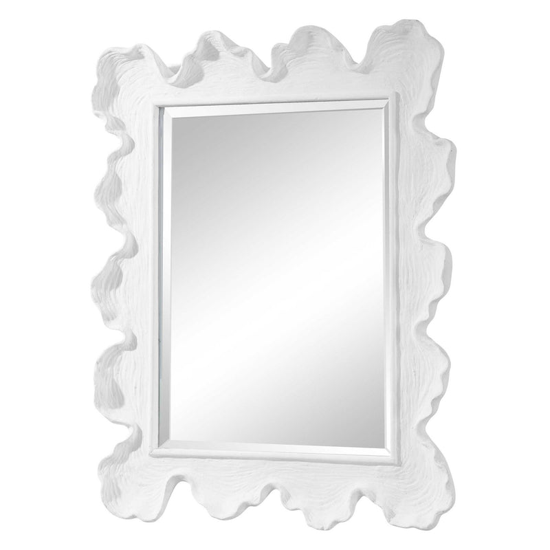 Uttermost Sea Coral wall mirror with a circular design resembling ocean coral, featuring a textured, natural finish.