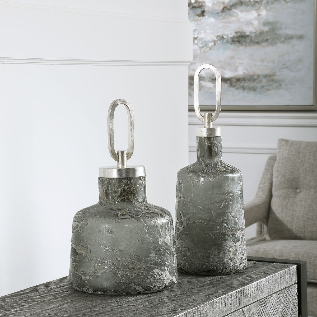 Set of two dark gray Storm Art Glass Bottles by Uttermost, decorative vases with sleek, modern design for stylish home decor.