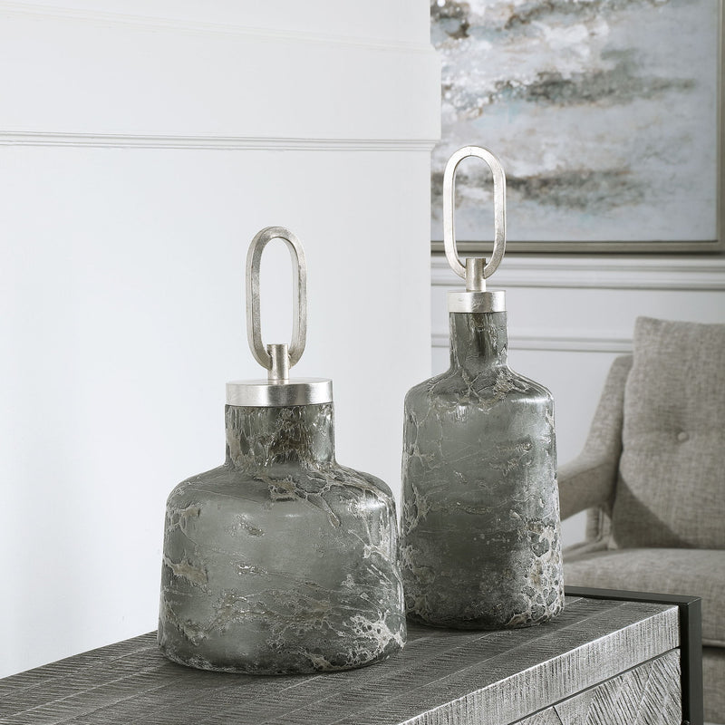 Set of two dark gray Storm Art Glass Bottles by Uttermost, decorative vases with sleek, modern design for stylish home decor.
