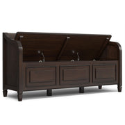 Simpli-Home Connaught storage bench with cushioned top and wooden legs, featuring built-in storage compartment for living room or hallway.